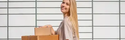 A girl carrying the shipping box
